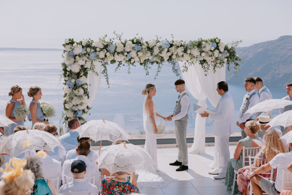 Couple saying vows at Le Ciel destination wedding in Greece