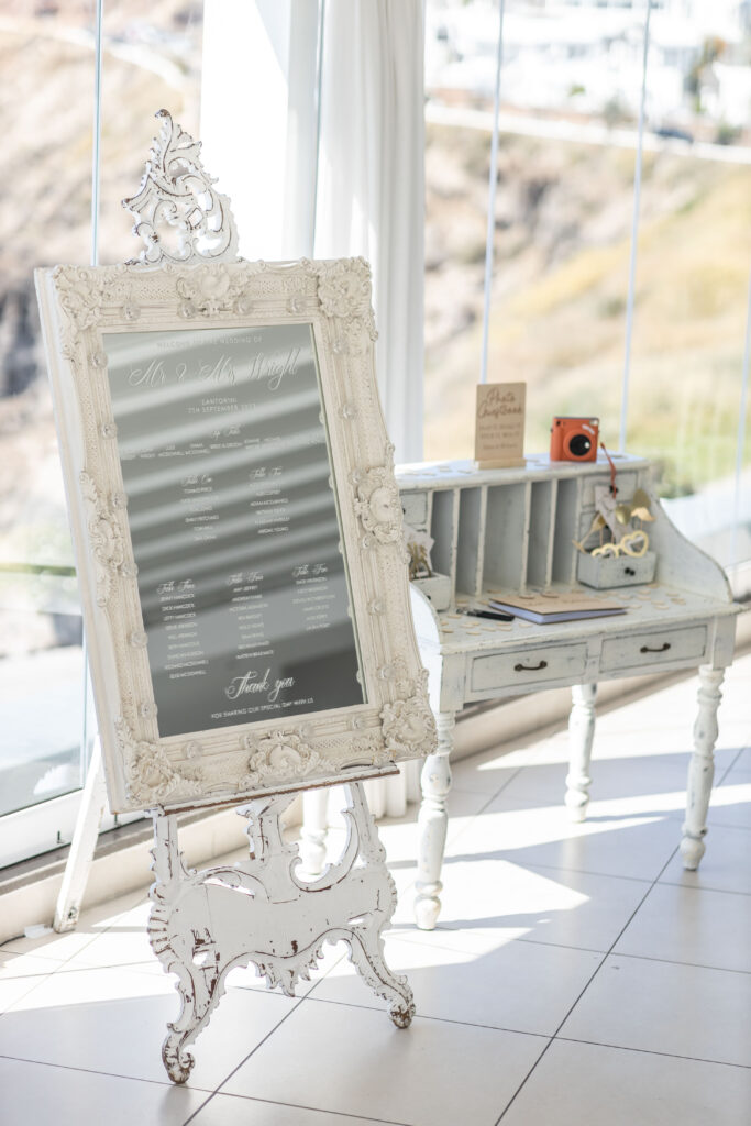 mirrored seating plan at Bethany and Adam's Le Ciel santorini wedding