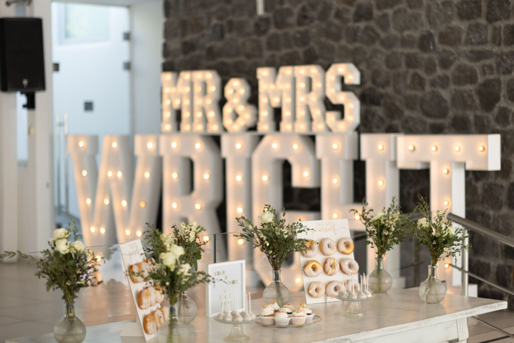 Mr and Mrs Wright light up letters at Le Ciel Santorini wedding