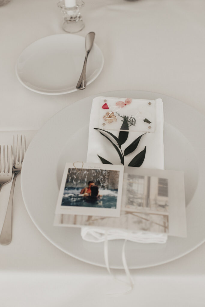 table setting with photo of guest at Anneliese and James Santorini wedding