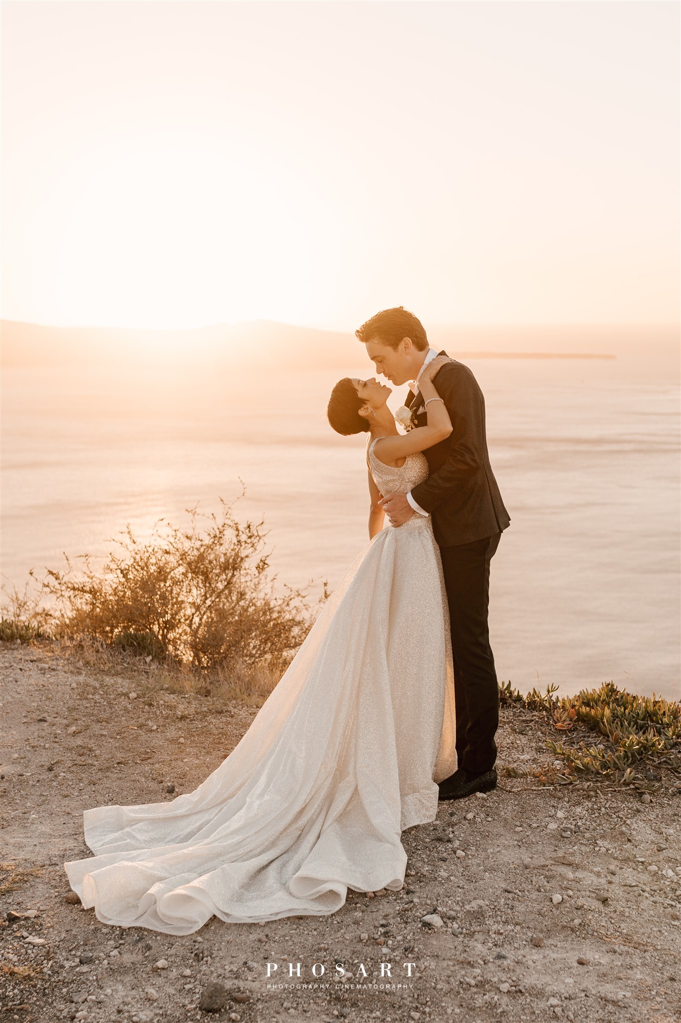 must-have destination wedding photo of bride and groom in front of Santorini sunset