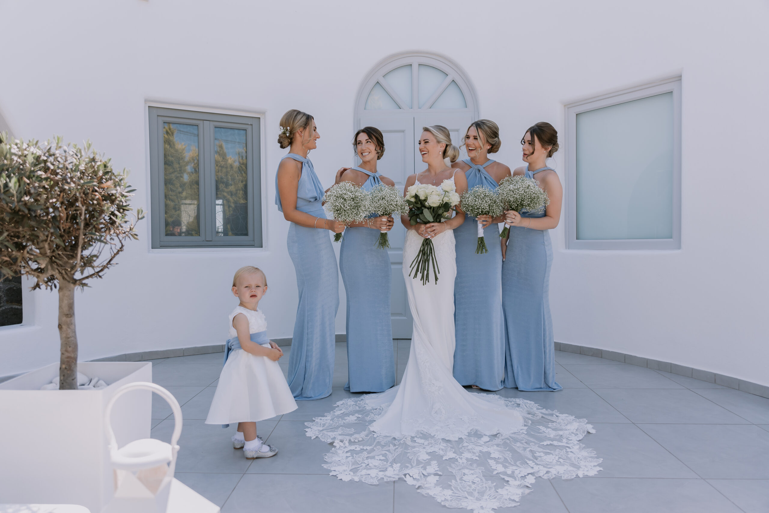 bride and bridesmaids with little flower girl at Le Ciel wedding