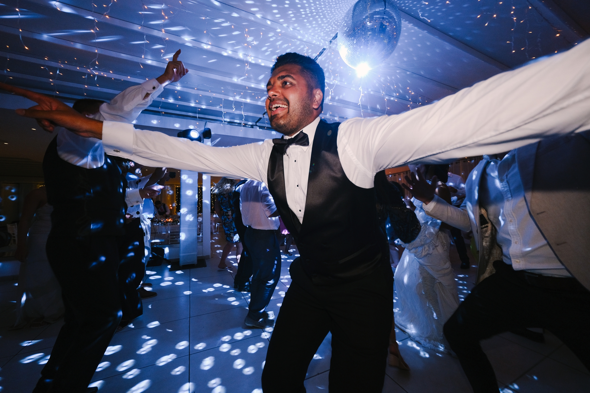 guest dancing at Santorini wedding evening reception
