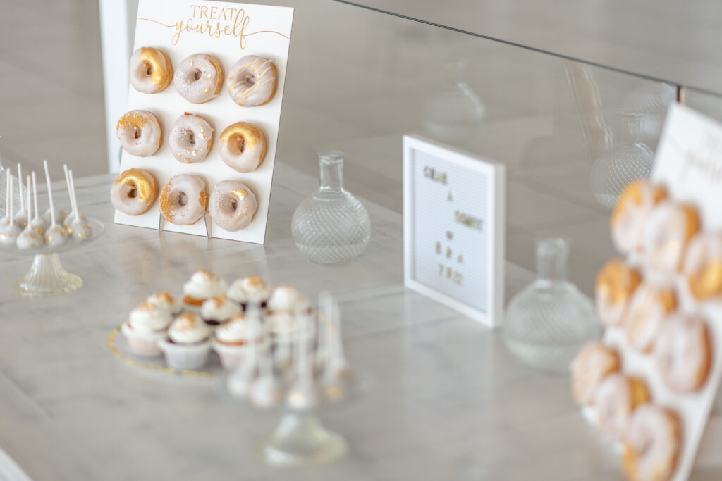 doughnut wall with help yourself sign at Santorini destination wedding