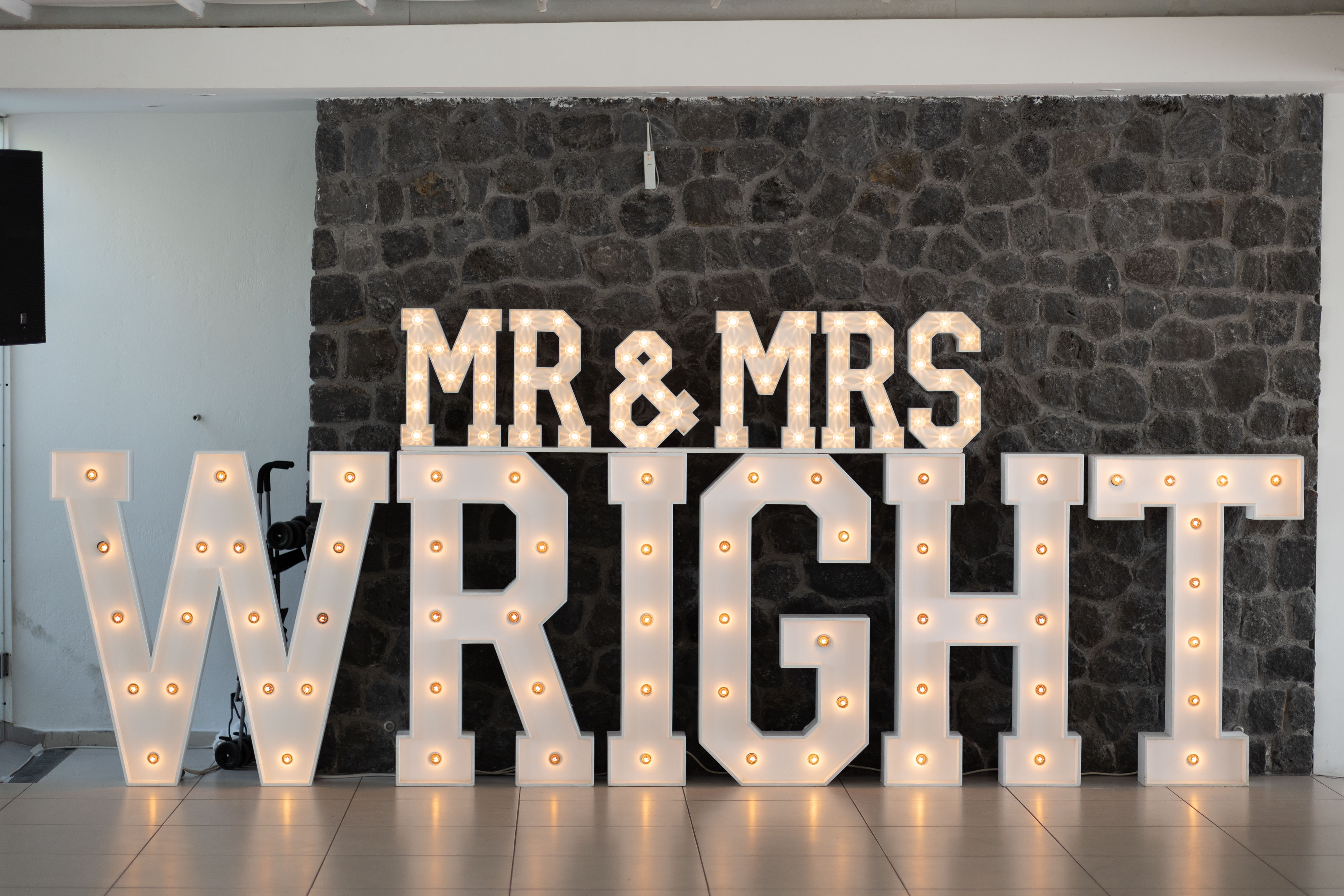Light up Mr and Mrs Wright letters at Le Ciel Santorini wedding reception