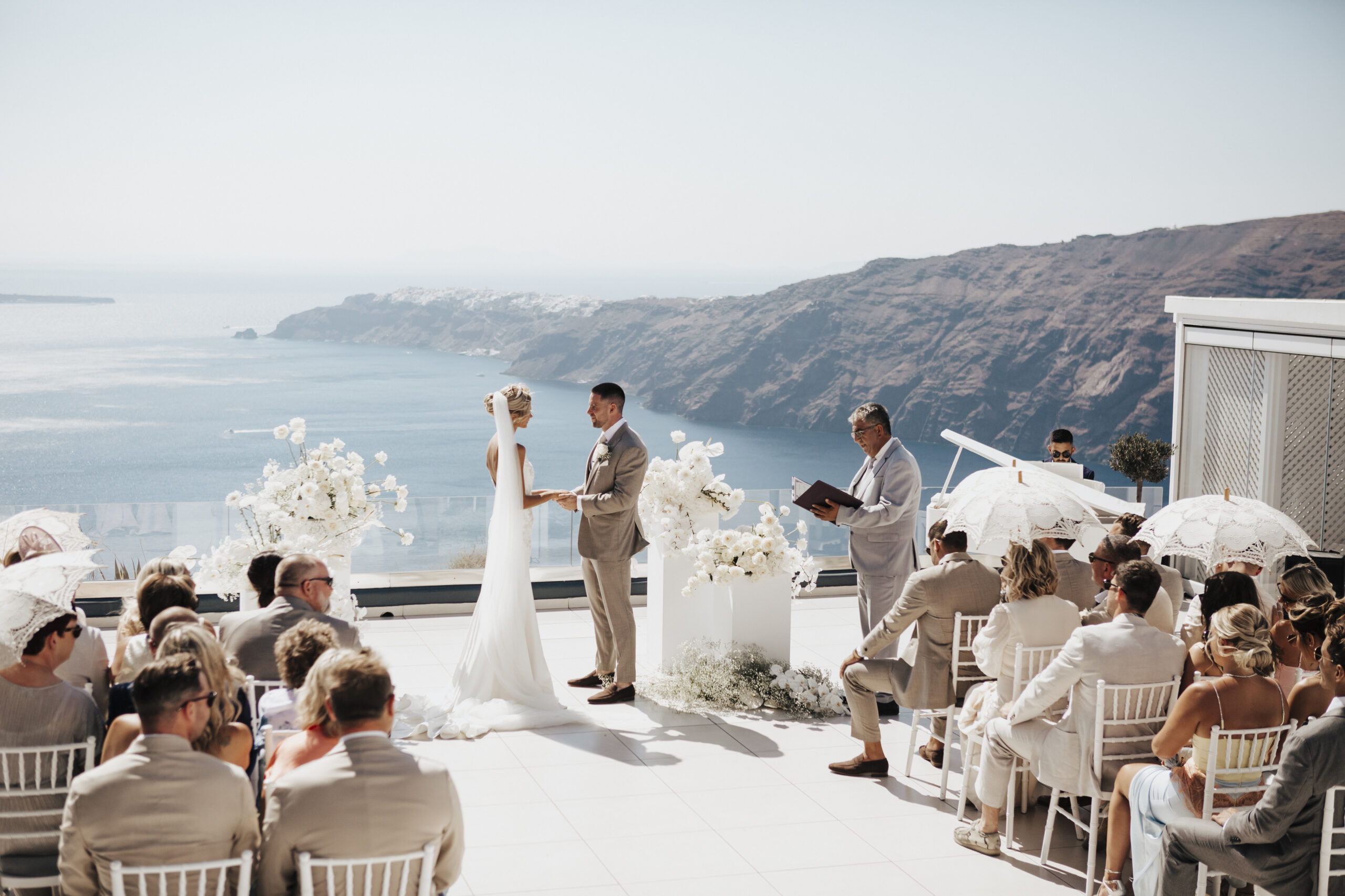 bride and groom getting married at a Santorini clifftop venue