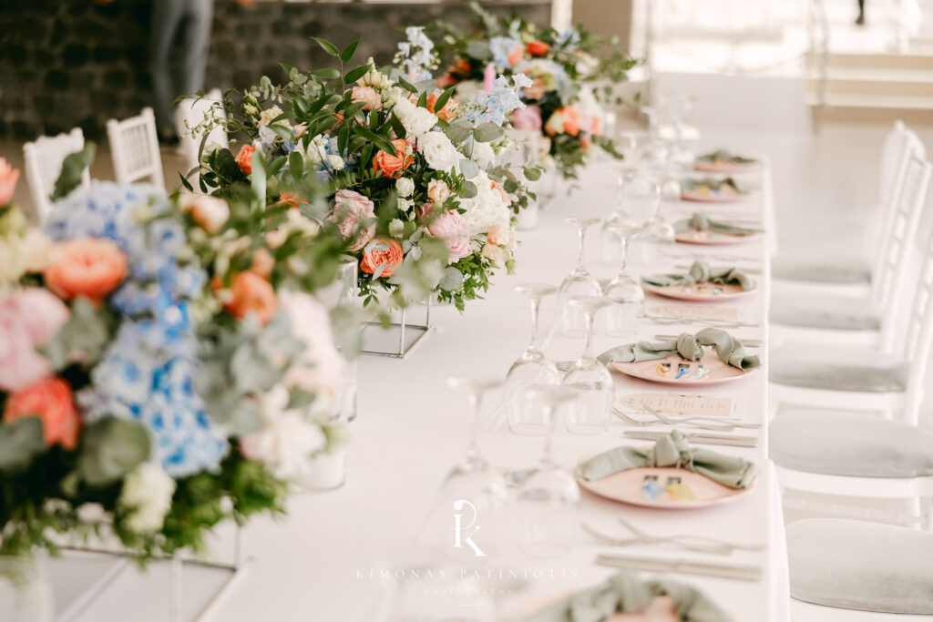 reception set up at Le Ciel with colourful destination wedding flowers