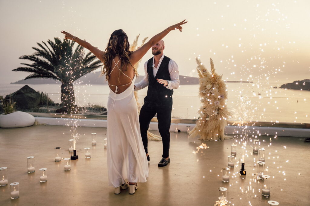 couple dancing surrounded by mini fireworks at Le Ciel