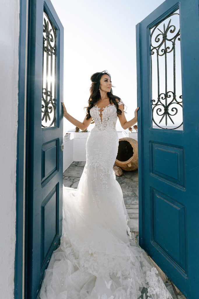 bride standing in doorway at destination wedding in fishtail dress