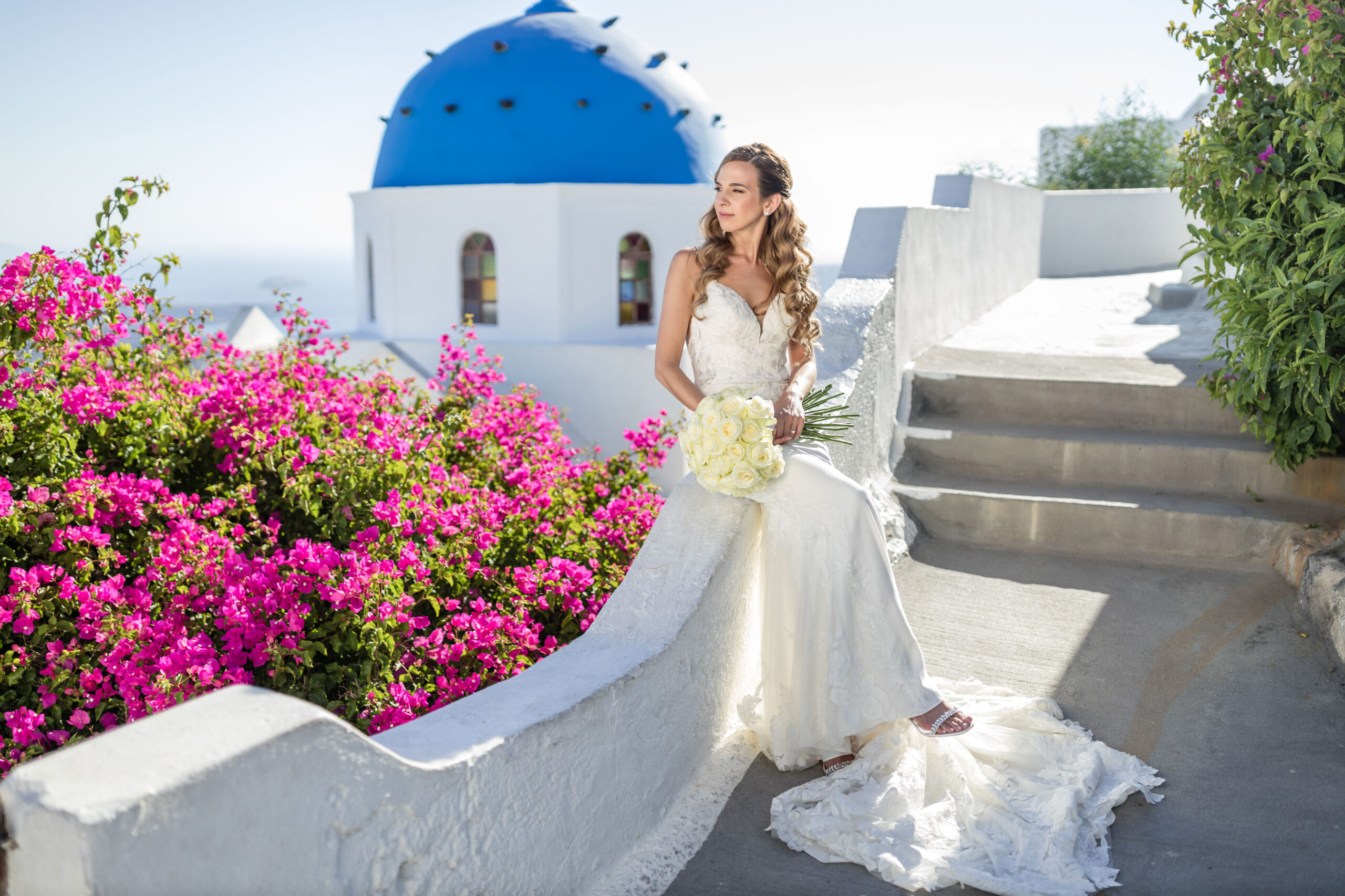bride wearing thin strap wedding dress at destination wedding in Santorini