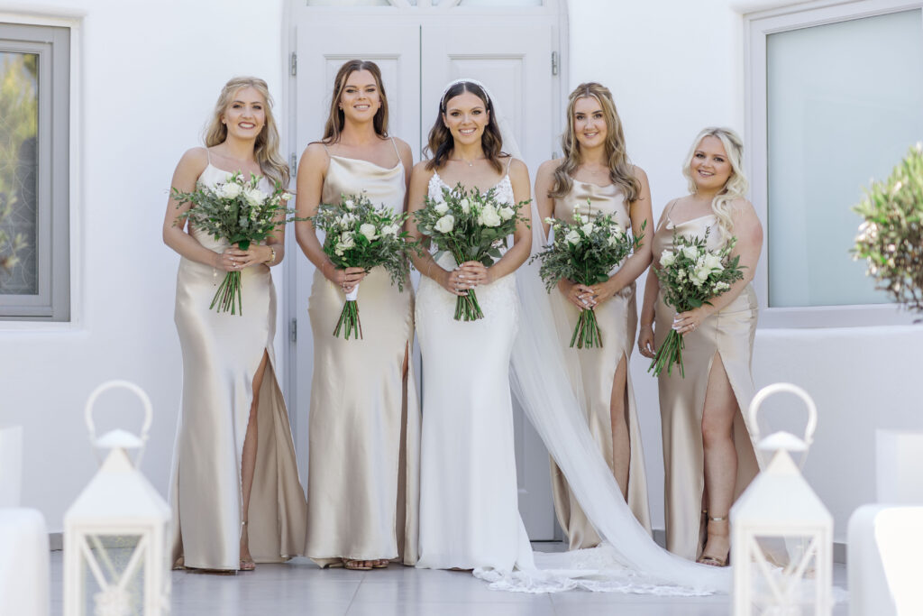 bride and bridesmaids wearing floor length silk slip dresses at destination wedding