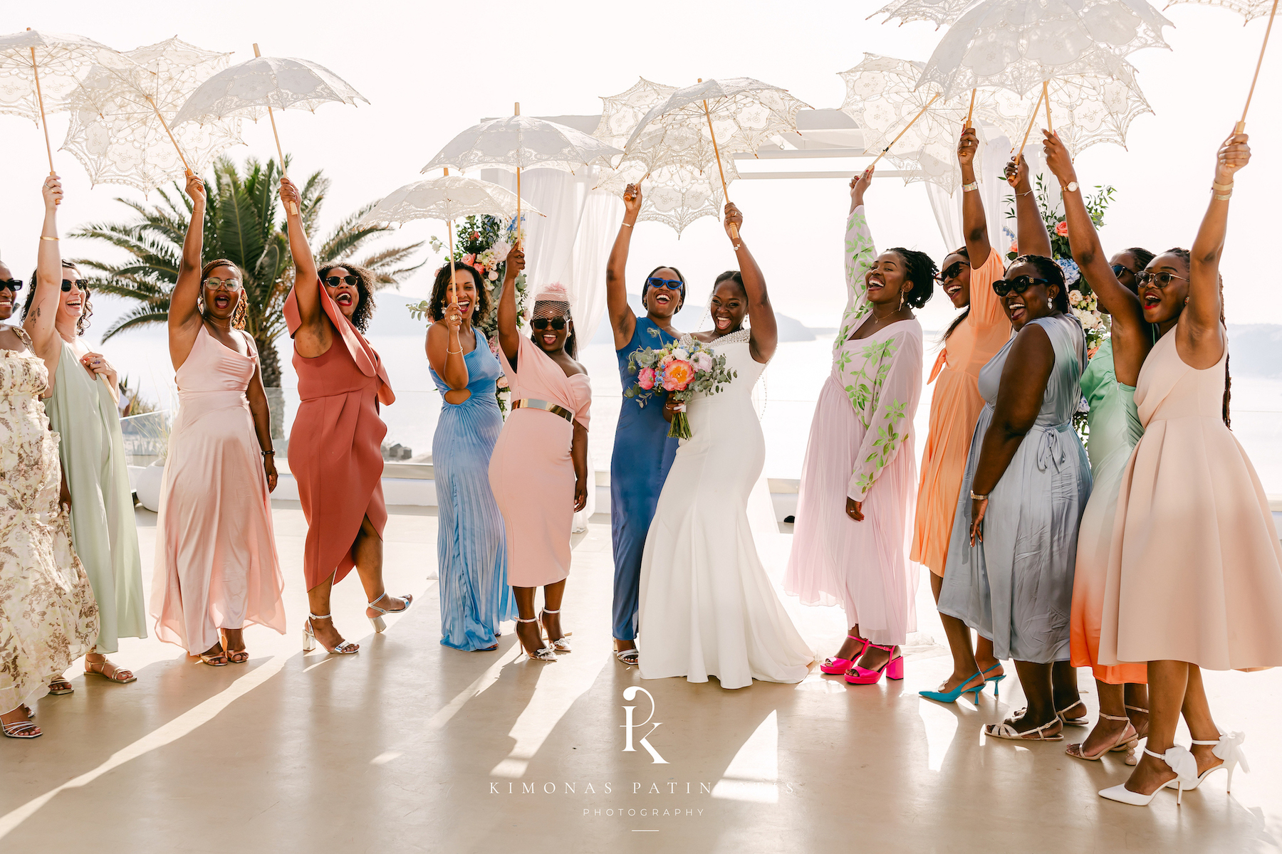 guests wearing colourful dresses dancing with bride at Le Ciel destination wedding