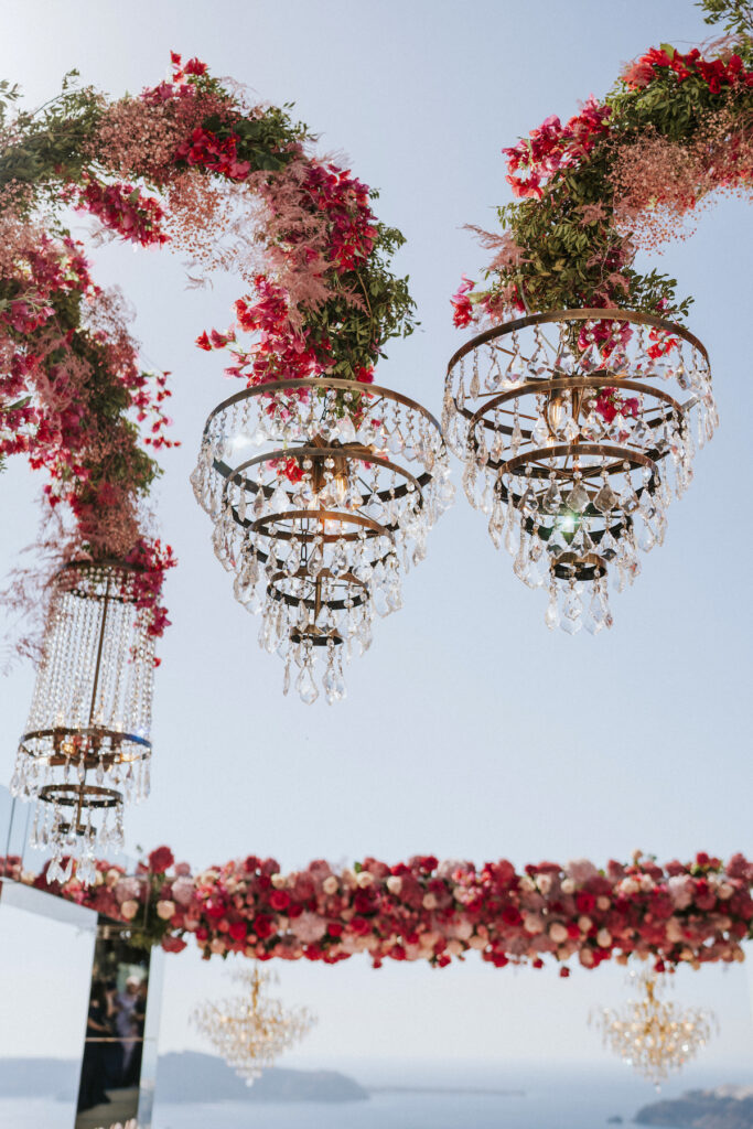 chandeliers hanging above open air wedding ceremony at Le Ciel Santorini