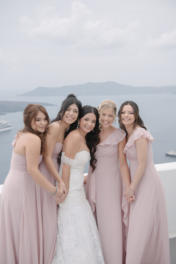 bride smiling with her bridesmaids