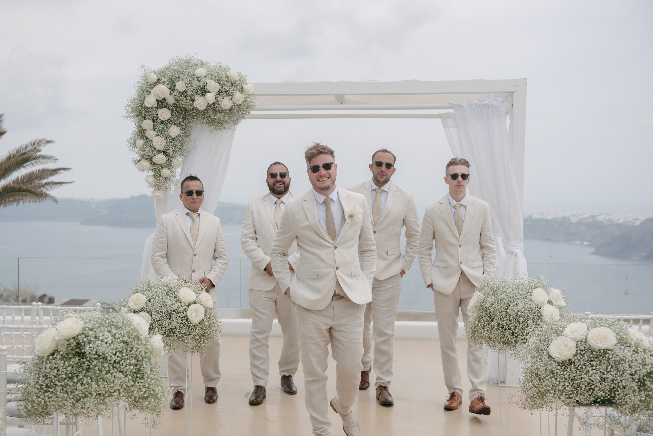 Jamie and his groomsmen at the aisle of Le Ciel in Santorini