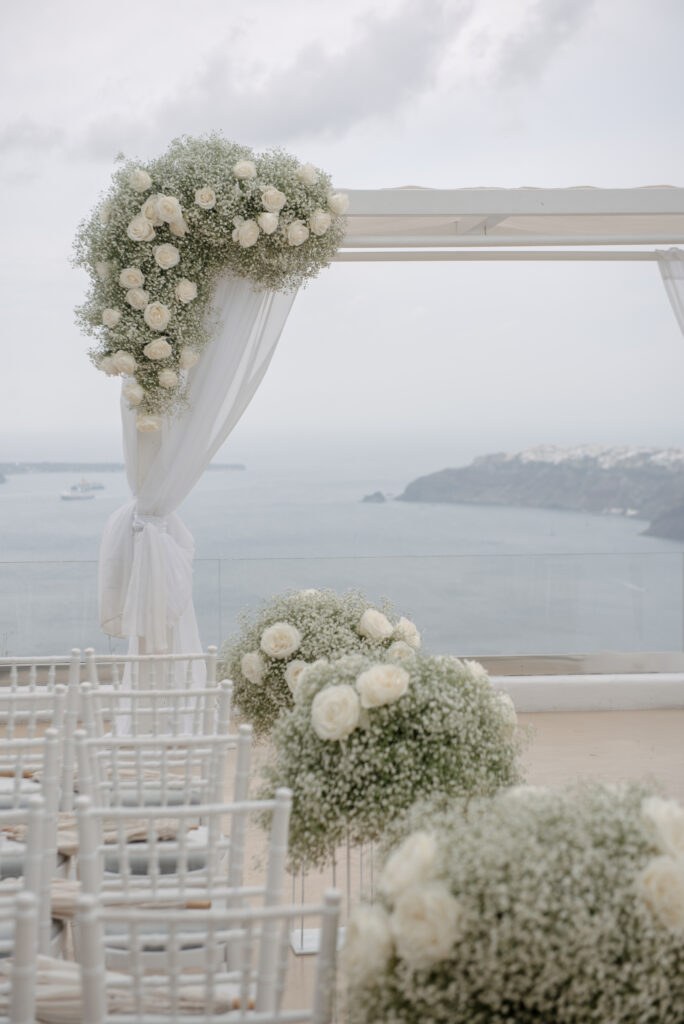 floral display around the aisle at Le Ciel Santorini destination wddding