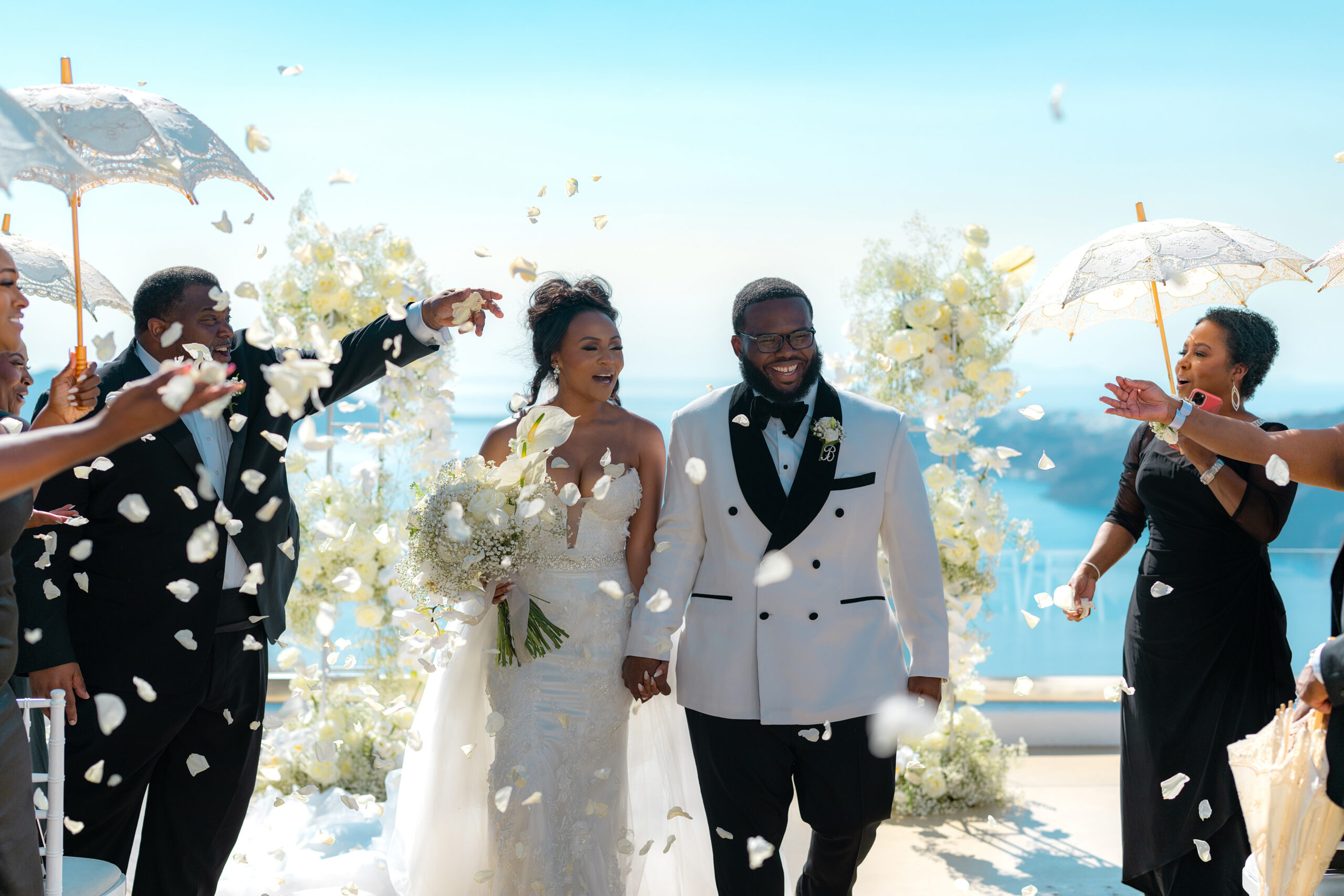 bride and groom covered in confetti at Santorini wedding