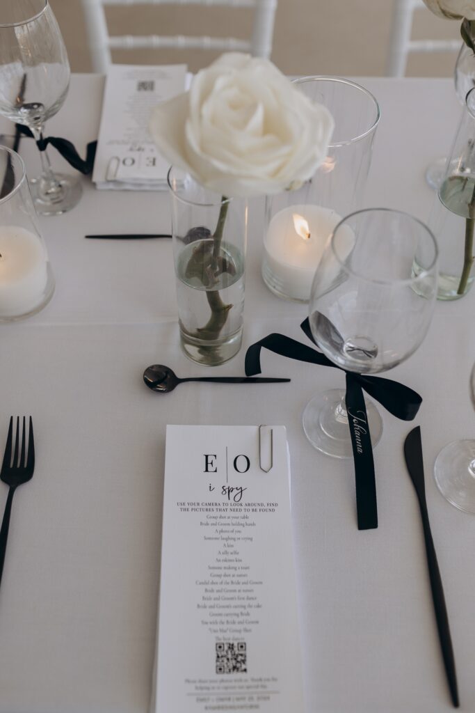 close up of table setting with black cutlery