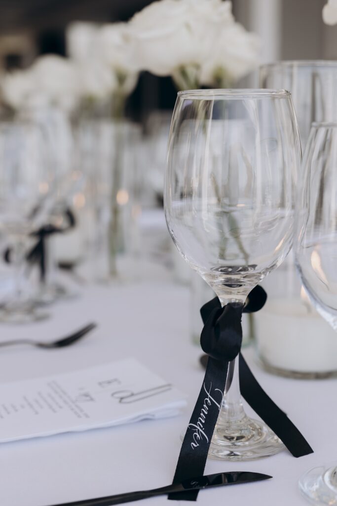 wine glass tied with black ribbon