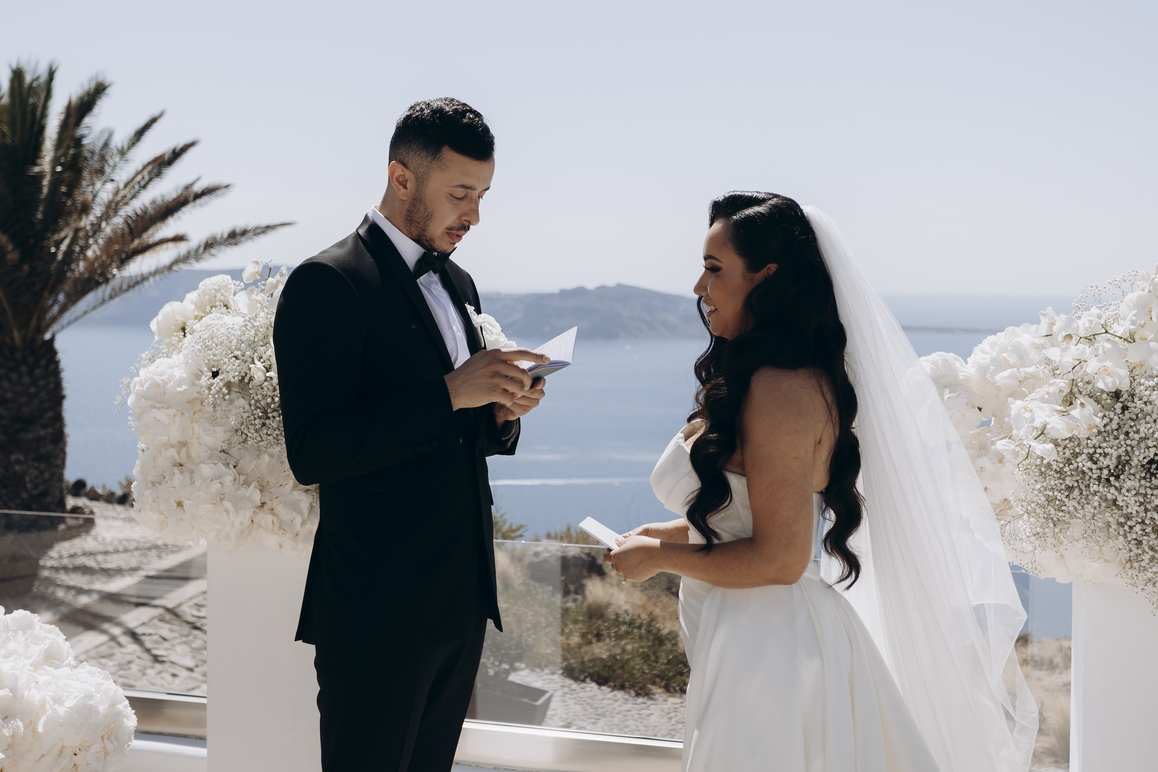 groom reading vows to bride at Le Ciel santorini wedding