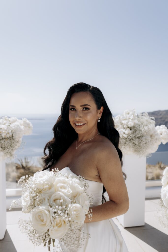 bride holding her bouquet of white flowers