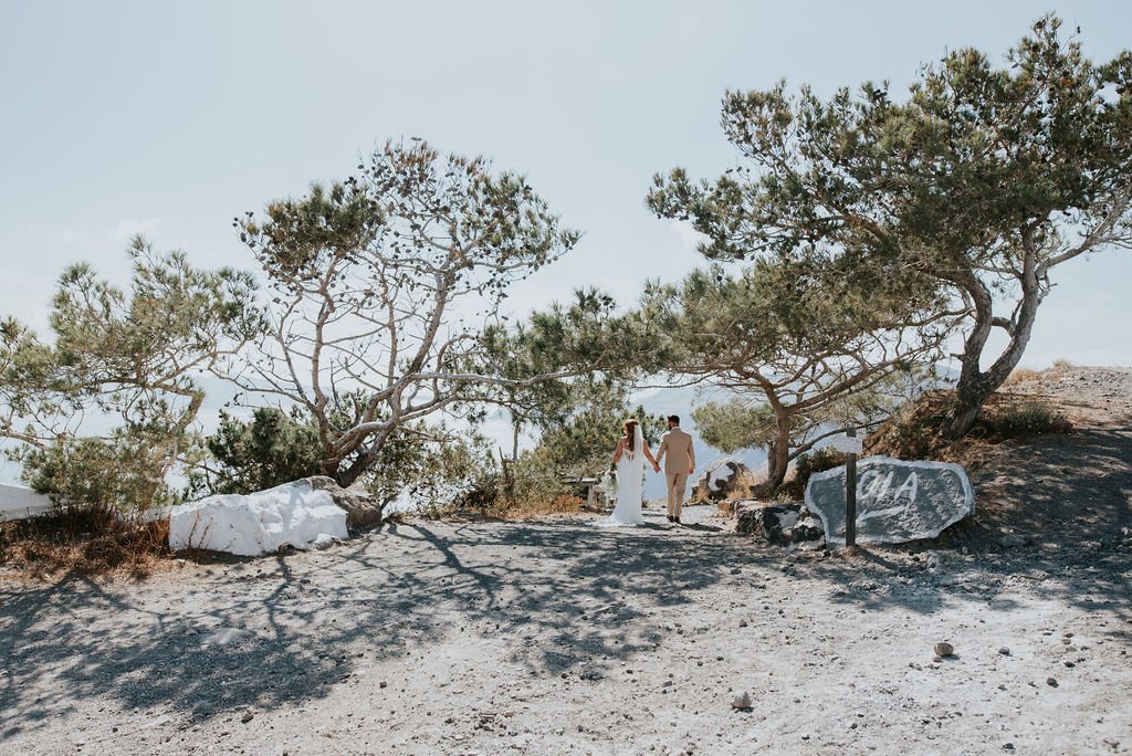 bride and groom in Santorini countryside near le Ciel